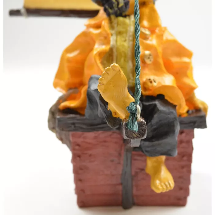 Fisherman In Yellow Raincoat Sitting Barefoot On His Sailboat Resin Figurine