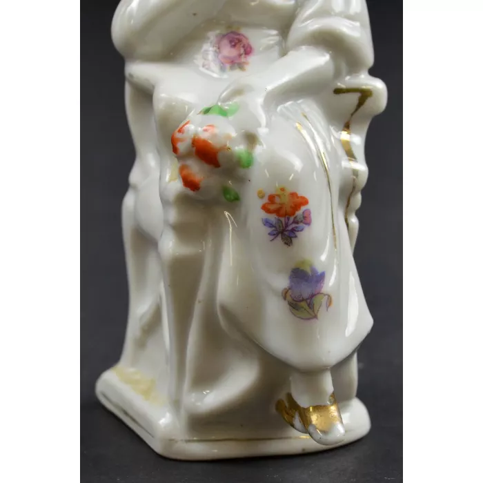 Woman Wearing A White Bonnet Sitting In Chair Ceramic Figurine - 5" Tall
